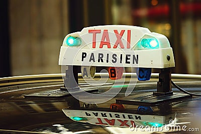 Parisian taxi sign on the roof of a car in the french capital Stock Photo