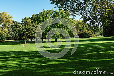 Parisians relaxing in Parc Montsouris at early autumn - Paris, France Editorial Stock Photo
