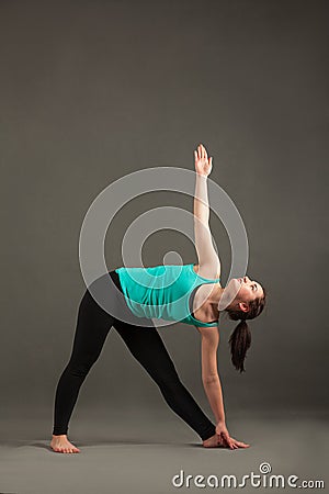 Parivritta-trikonasana yoga Stock Photo