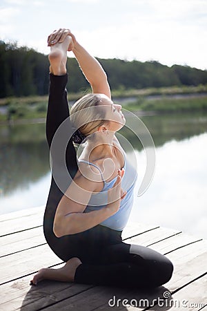 Parivrtta Surya Yantrasana yoga Pose Stock Photo