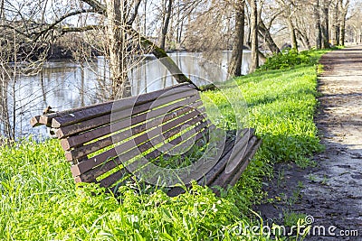 A park bench, deserted due to covid-19 limitations Stock Photo