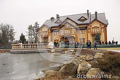 Park and building of Residence and park of former President Victor Yanukovich, people walking around. Mezhyhirya, Ukraine Editorial Stock Photo