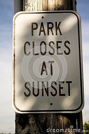 Park closes at sunset Stock Photo