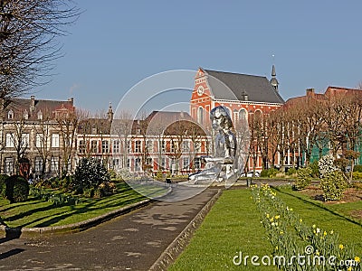 Park on Franklin Roosevelt square and artotheque buildig in Mons Editorial Stock Photo