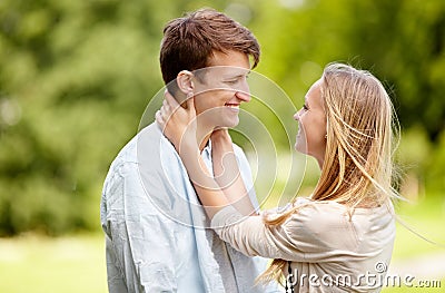 Park, happy and couple smile, eye contact and in nature, natural garden or romance date for freedom, love or bond Stock Photo