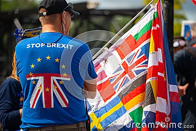 Anti-Brexit campaigner with large flag at the March For Change protest demonstration. Editorial Stock Photo