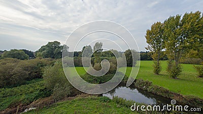 A park at late September, view of a river Stock Photo