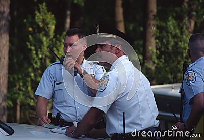 Park policeman talking on the radio Editorial Stock Photo