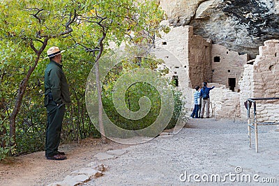 Park Ranger looking at mother and son visiting Cliff Palace in Mesa Verde National Park Editorial Stock Photo