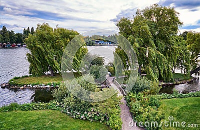 Park with small island on the Schwerin lake. Mecklenburg-Vorpommern, Germany Stock Photo