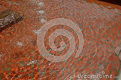 In the park there is a paddling pool for children with clean filtered water. The surface of the pool tank is painted with cement Stock Photo