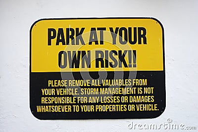 Park at your own risk sign Stock Photo