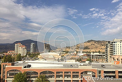 Parkade and high rise buildings in downtown Kelowna BC Stock Photo