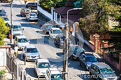 Parked cars along a cobblestone street in Alba Iulia, Romania, 2020 Editorial Stock Photo