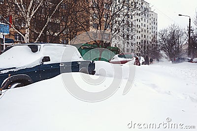 Parked cars covered in fresh snow Stock Photo