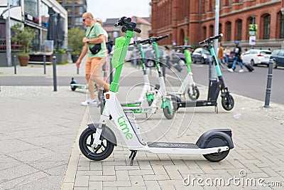 Parked electric scooter of the Lime group in Berlin Editorial Stock Photo