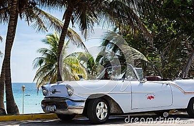 Parked white classic car near the beach in Cuba Havana Editorial Stock Photo