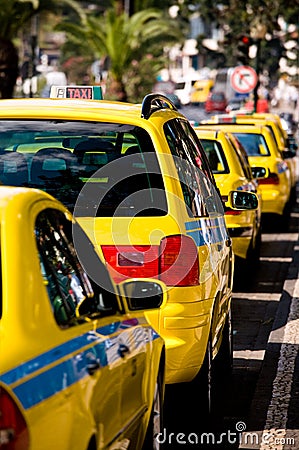 Parked Yellow Taxi Cab Waiting for a Fare Stock Photo
