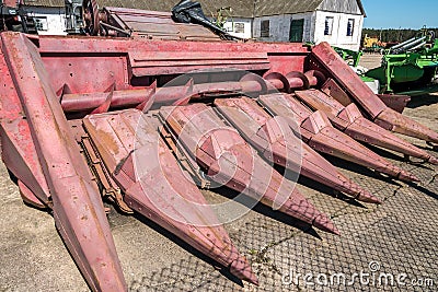 Parking agricultural machinery and harvest. rows of plows, cultivators, bodies Stock Photo