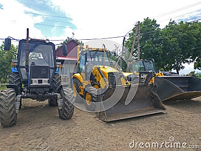 parking of agricultural machinery after working in the field Editorial Stock Photo
