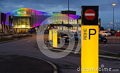 Parking area and illuminated front of the retail park Shopping City South Editorial Stock Photo