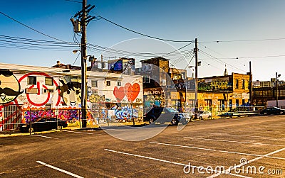 Parking lot and graffiti on old buildings in Baltimore, Maryland Editorial Stock Photo
