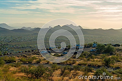 Parking lot near national park in the hills of Tuscon Arizona with a view of the sonora desert at hazy sunset Stock Photo