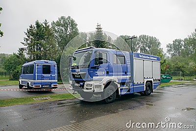 On the parking lot are the vehicles of the technical relief organization THW Editorial Stock Photo