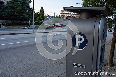 Parking Meter on the side of the road or street to park and pay in coins in downtown. Canada Stock Photo