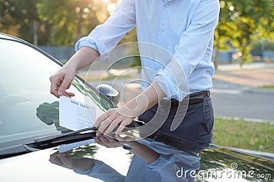 Parking violation ticket fine on windshield Stock Photo