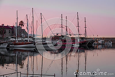 Parking of yachts in the city of Kyrenia harbor in northern Cyprus at sunset. Editorial Stock Photo