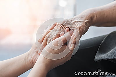 Parkinson disease patient, Alzheimer elderly senior, Arthritis person hand in support of nursing family caregiver care Stock Photo