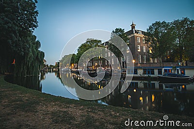 Parkside canal in Amsterdam, Netherlands at sundown Stock Photo