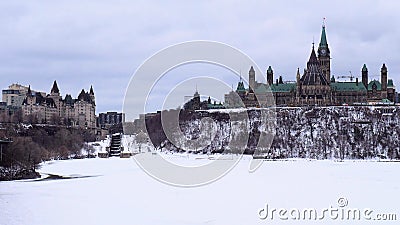 Parliament Building on Canada stands tall on Parliament Hill on a grey gloomy day. Stock Photo