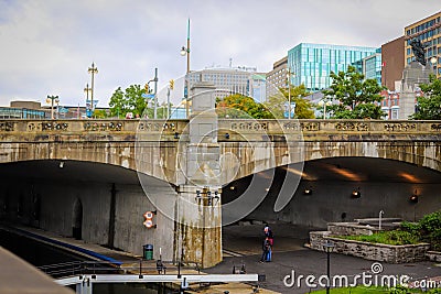 Parliament Hill, Ottawa, Rideau canal. Old bridge. Cloudy sky in Autumn city Editorial Stock Photo