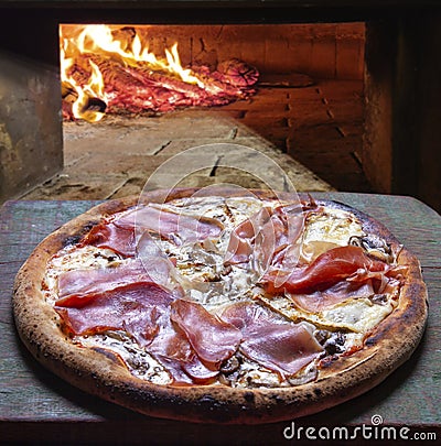 Parma ham pizza baked in the wood oven food Stock Photo