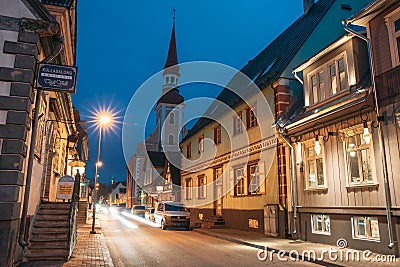 Parnu, Estonia. Night Puhavaimu Street With Old Wooden Houses, Restaurants, Cafe, Hotels And Shops In Evening Night Editorial Stock Photo