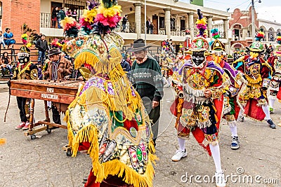 Traditional folk dancers in mask & costume dance to marimba music, Guatemala Editorial Stock Photo