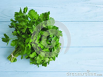 Parsley bunches on a blue wooden Stock Photo