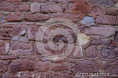 part of an ancient building, monastery, beautiful grey vintage texture of the wall of a medieval castle built in middle of 14th Stock Photo