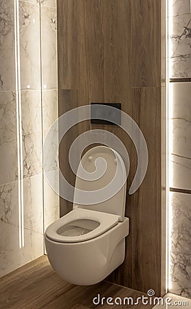 Part of the bathroom with a view of the open toilet. Stock Photo