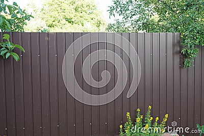 Part of a brown metal fence wall Stock Photo