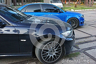 April 3, 2015, Odessa, Ukraine; Part of the car is BMW and Audi. Side view Editorial Stock Photo