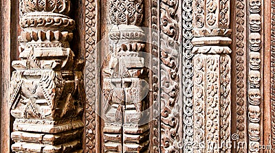 Part of carved wooden door on Hanuman Dhoka old Royal Palace in Stock Photo