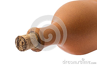 Part of a clay bottle closed with a cork on a white background. Stock Photo