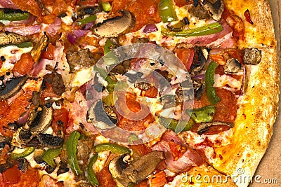 Part of the closeup pizza with mushrooms and bacon. Stock Photo