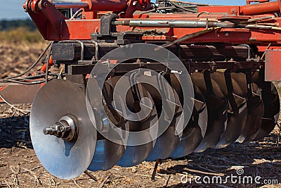 Part of the cultivator, steel, round discs in a row. Stock Photo