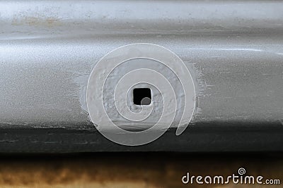 Part of a damaged car body with an epoxy primer protective coating applied Stock Photo