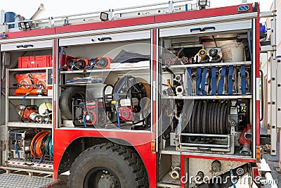 Part of equipment of a firetruck: hoses and syringe of a water cannon Stock Photo