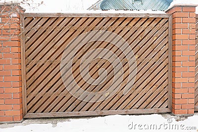 Part of the fence with a neat diagonal straps. Close up Stock Photo